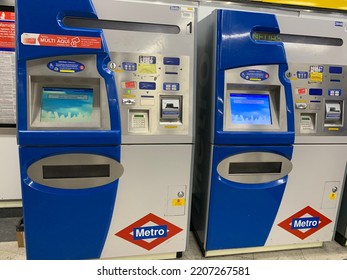 Madrid, Spain - September 24, 2022: The Madrid Metro Self Service Ticket Machines Next To The Entrance To Sol Subway, Metro, Underground Station. Madrid's Metro System Logo On Machines