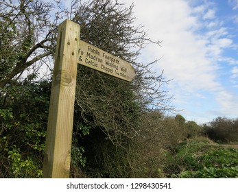 Madron. Cornwall. England. March 21. 2012. To Wishing Well And Celtic Chapel Sign. 