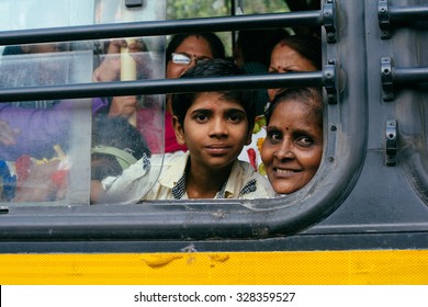 MADURAI, INDIA-SEPTEMBER 16: Indian Bus 16, 2014 In Madurai, India. People In The Indian Bus. A Boy Smile Throught The Bus Window