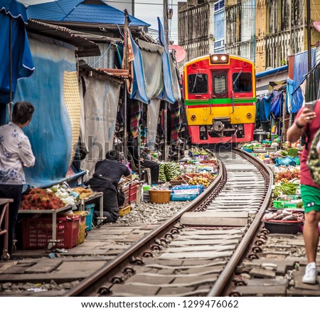 Maeklong Railway Market, a local market commonly called Siang Tai (life-risking) Market. Spreading over a 100-metre length, the market is located by the railway near Mae Klong Railway Station
