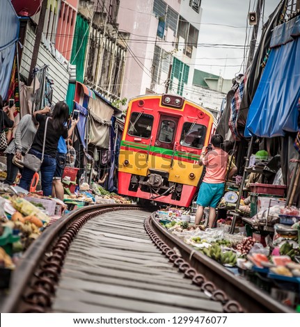 Maeklong Railway Market, a local market commonly called Siang Tai (life-risking) Market. Spreading over a 100-metre length, the market is located by the railway near Mae Klong Railway Station
