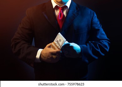 Mafia Man In Suit Counting Money On Black Background.