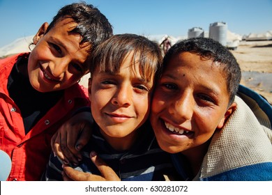 Mafraq, Jordan - June 2, 2014 : Syrian children posing for Camera at the Zaatari refugee Camp in Mafraq, Jordan