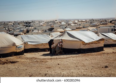 Mafraq, Jordan - June 2, 2014 : Syrian Children Standing Outside Their Tent At The Zaatari Refugee Camp In Mafraq, Jordan.