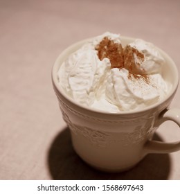 Mag Cup Full Of Whipped Cream With Cinnamon. 