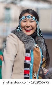 Magadan, Magadan Region, Russia - May 1, 2018. Portrait Of A Beautiful Happy Young Woman. Jewelry And Clothing With Traditional Bead Designs. Indigenous Peoples Of Siberia And The Russian Far East.