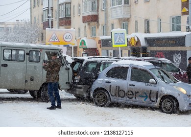 Magadan, Magadan Region, Russia - November 8, 2021. Car Accident At The Crossroads. Several Cars Collided On A Snow-covered Slippery Road. On One Of The Cars Is The Text Uber.