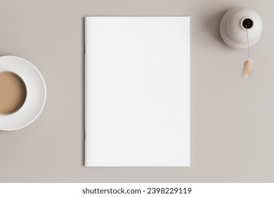 Magazine mockup with a lagurus and a cup of coffee on the beige table. - Powered by Shutterstock