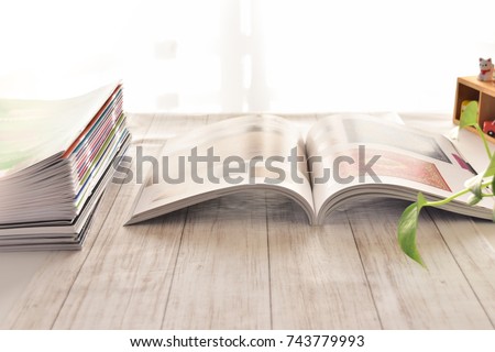 Magazines, brochures and catalog on the table