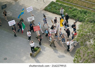   Magdeburg, Germany – May 20, 2022: Protest Against The Congress Of German Child And Adolescent Psychiatry In Magdeburg. Translation On The Sign: Psychiatrists Are Criminals In White Coats           