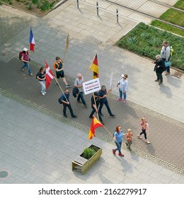   Magdeburg, Germany – May 20, 2022: Protest Against The Congress Of German Child And Adolescent Psychiatry In Magdeburg. Translation On The Sign: Psychiatrists Are Criminals In White Coats           