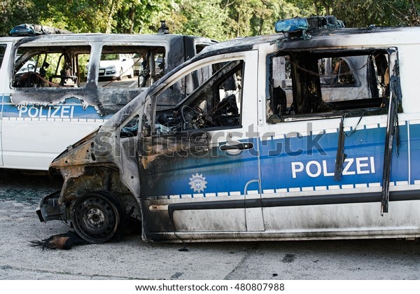 MAGDEBURG, GERMANY  \
SEPTEMBER 08, 2016: Burnt-out cars after an arson attack on police\
cars in the center of Magdeburg on 08.September 2016. 18 cars\
burned in this\
attack.