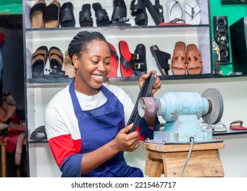 mage of Beautiful young black teenage african female shoe entrepreneur on apron folding working  - Powered by Shutterstock