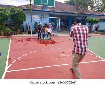 Magelang, Central Java, Indonesia - May 27, 2022:
Photographer Taking Photo For School Yearbook