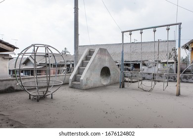 Magelang, Central Java, Indonesia, Nov 2010: Thick Volcanic Ash Fall On A Playground In A Village Near The Merapi Volcano. In Late 2010 Mount Merapi Began An Increasingly Violent Series Of Eruption
