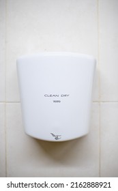 Magelang, Indonesia - May 12 2022: a hand dryer in the wall as a standard hospitality of public toilet