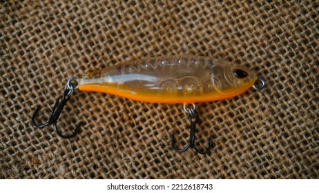 Magelang, Indonesia - October 9th 2022 : Artificial Lure Made From Plastic For Fishing By Casting. Casting Lure With Hook On The Burlap - Artificial Lure With The Shape Of Minnow
