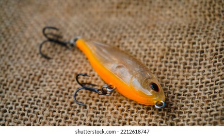 Magelang, Indonesia - October 9th 2022 : Artificial Lure Made From Plastic For Fishing By Casting. Casting Lure With Hook On The Burlap - Artificial Lure With The Shape Of Minnow
