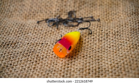 Magelang, Indonesia - October 9th 2022 : Artificial Lure Made From Plastic For Fishing By Casting. Casting Lure With Hook On The Burlap - Artificial Lure With The Shape Of Minnow
