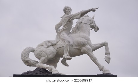 Magelang, Indonesia - September 17th 2022 : Diponegoro Statue Ride The Horse Build On The Park With Cloudy Sky. Building Icon On The Magelang Town Square
