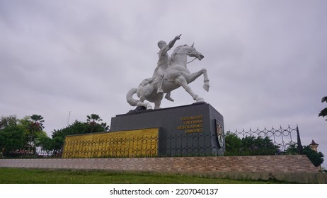 Magelang, Indonesia - September 17th 2022 : Diponegoro Statue Ride The Horse Build On The Park With Cloudy Sky. Building Icon On The Magelang Town Square
