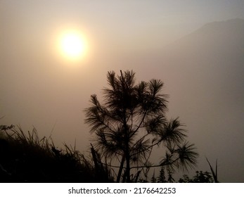 Magelang, Indonesia - September 30 2018 : Watching The Sunrise On The Top Of Mount Andong While Climbing With Friends