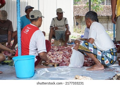 
Magelang, July 10, 2022 - Asian Men Cutting Beef During Eid Al-Adha Celebrations. Eid Al-Adha Is The Second And Bigger Of The Two Main Holidays Celebrated In Islam