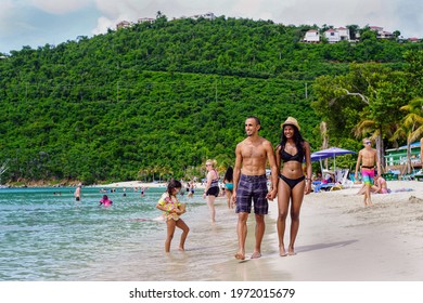 Magen's Bay, St Thomas United States Virgin Islands - August 18 2019: Happy, Mixed Race, South Asian Couple Walking Beside The Water At Magens Bay Beach In St. Thomas United States Virgin Islands.