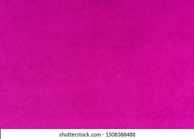 Magenta colored fabric. Cloth background. Natural fabric. Fuchsia colored fabric.
