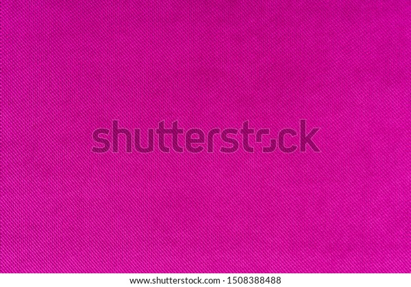 Magenta colored fabric. Cloth background. Natural\
fabric. Fuchsia colored\
fabric.