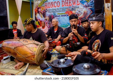 Magetan, East Java, Indonesia - January 01, 2022: Indonesian Javanese musical instrument. Javanese men playing gamelan, drums, bonang or other famous Javanese traditional musical instruments.
