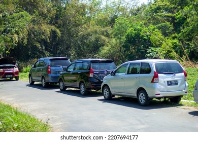 Magetan, Indonesia - 28 September 2022: Car Parking. Lined Up Parked Cars