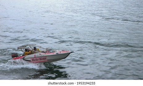 Magetan, Indonesia - April, 10 2021: The Speed Boat Tour Rides On The Lake Go Fast