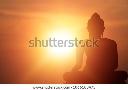 Magha Asanha Visakha Puja Day , Silhouette Buddha on golden sunset background.