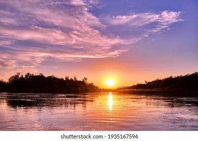 Magic atmosphere of a romantic evening; golden sunset on the river - Powered by Shutterstock