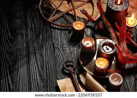 Magic attributes on dark wooden wizard table