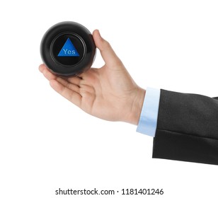 Magic ball with prediction Yes in hand isolated on white background