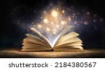 Magic Book With Open Antique Pages And Abstract Bokeh Lights Glowing In Dark Background - Literature And Education Concept