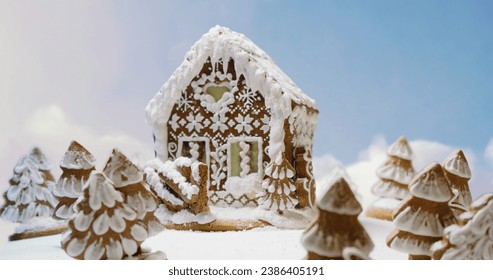 Magic Christmas gingerbread house with trees on white sweet background with clouds around - Powered by Shutterstock