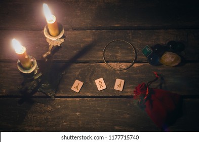 Magic divination runes on fortune teller desk table background. Futune reading concept. - Shutterstock ID 1177715740