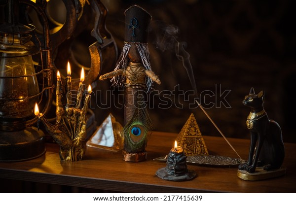 Magic\
doll for attracting love, rite with voodoo and fate creation,\
details on a table of witch, occultism concept\
