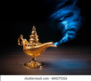 Magic Genie Lamp With Smoke On A Dark Background