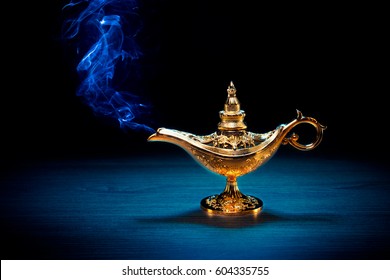 Magic Genie Lamp With Smoke On A Dark Background