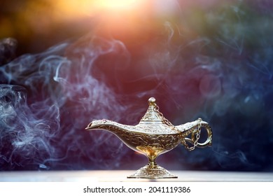 Magic lamp from the story of Aladdin in smoke concept for wishing, luck and magic - Shutterstock ID 2041119386