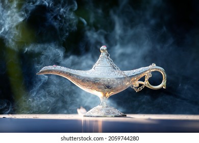 Magic lamp from the story of Aladdin in smoke. Concept for wishing, luck and magic - Shutterstock ID 2059744280