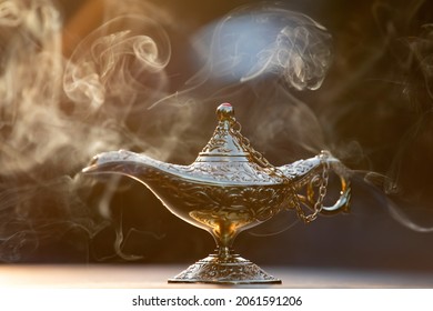 Magic lamp from the story of Aladdin in smoke concept for wishing, luck and magic - Shutterstock ID 2061591206