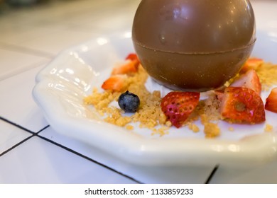 Magic Melting Chocolate Ball Wit Fruit On White Plate