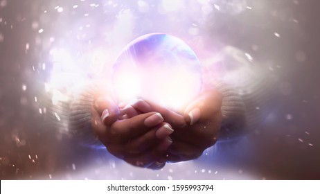 Magic particles emanating from female hands. Glass ball in the hands. Magic particles on the palms, magic, witchcraft. - Shutterstock ID 1595993794