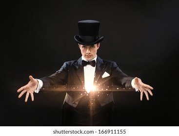 Magic, Performance, Circus, Show Concept - Magician In Top Hat Showing Trick