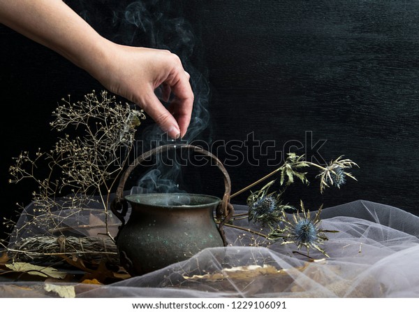 Magic pot with herbs and\
witchcraft
